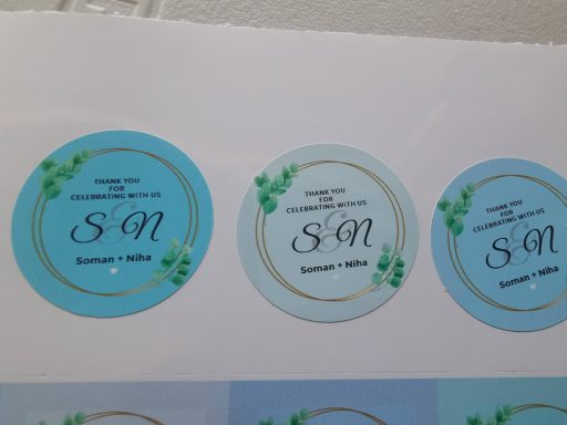 Three circular labels with "SN" in decorative fonts and green leaf accents.